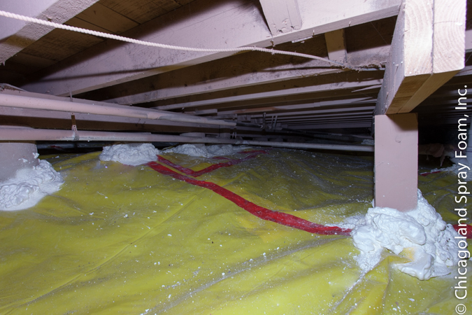 Picture of crawlspace with 15 mil vapor barrier over dirt floor